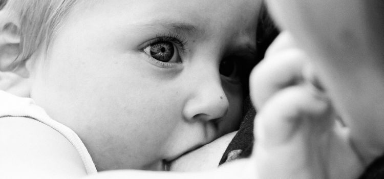 Why Do Babies Touch Your Face While Breastfeeding