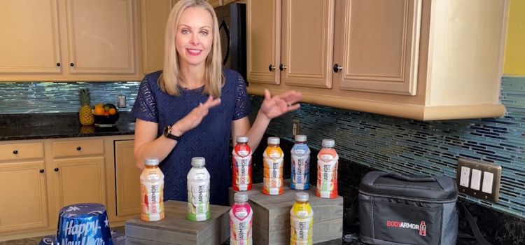 An expert explaining various flavors of BodyArmor drinks, providing options for pregnant women to stay hydrated